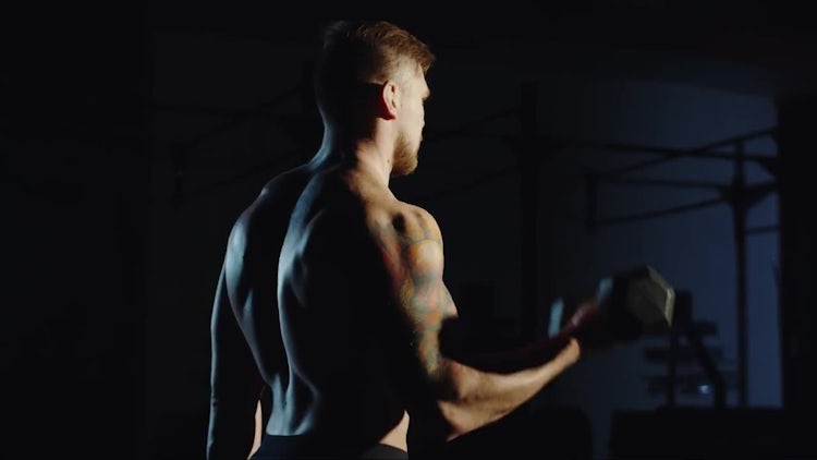 Male Bodybuilder Lifting Heavy Dumbbells: Stock Video