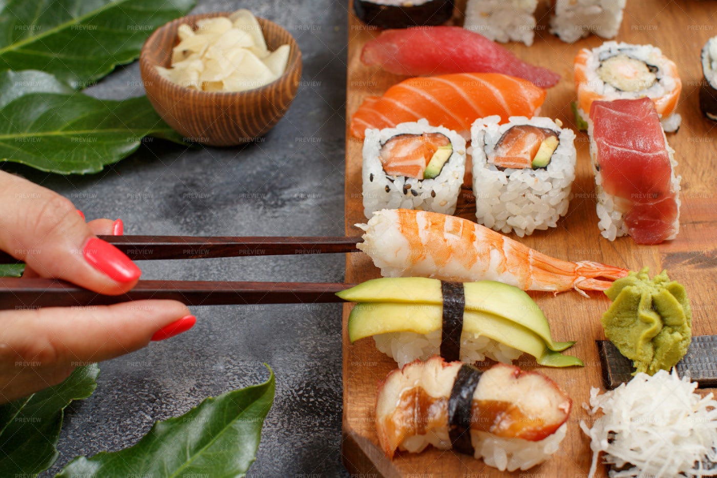 Hand Taking Sushi Rolls: Stock Photos