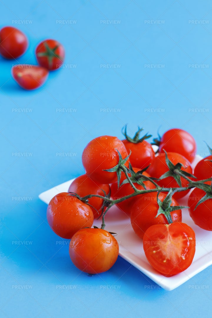Cherry Tomatoes On Blue: Stock Photos