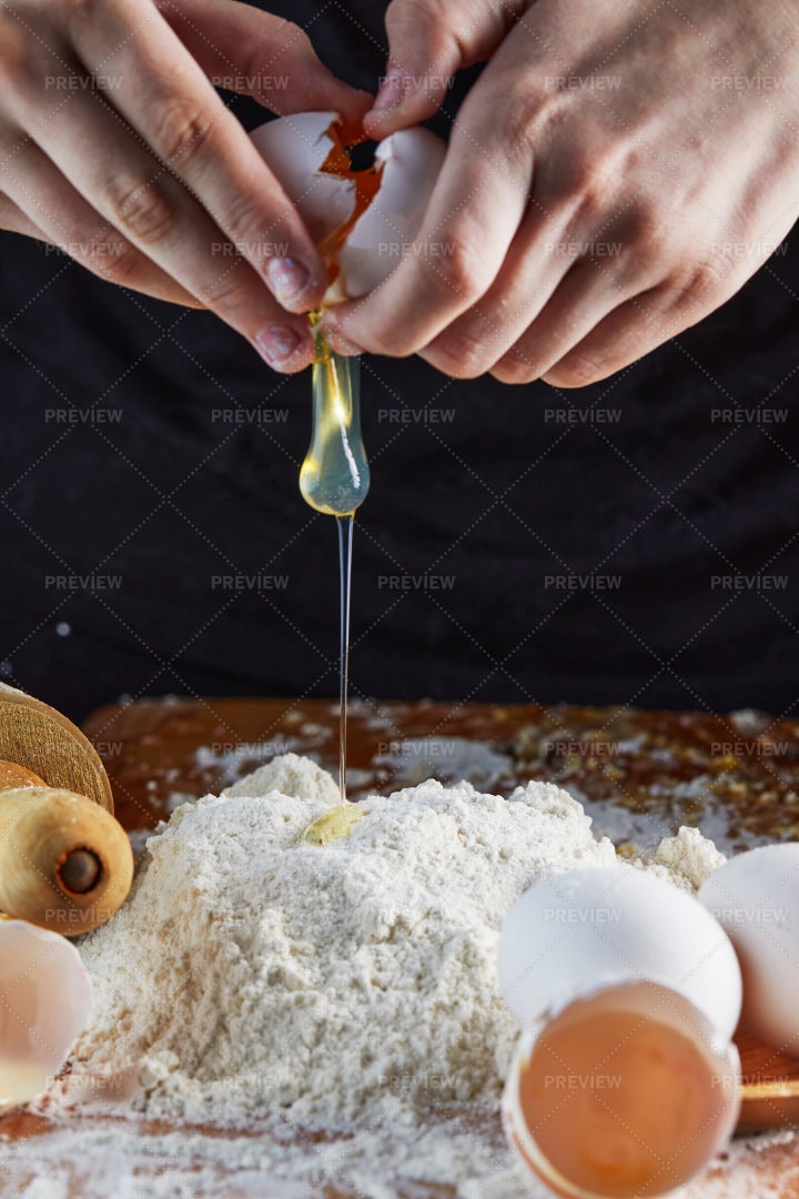 Adding Egg To Dough: Stock Photos