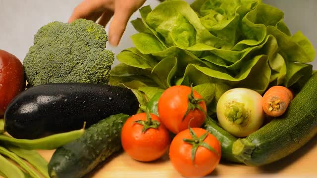 Selecting Vegetables From A Pile: Stock Video