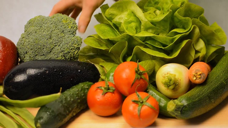 Selecting Vegetables From A Pile: Stock Video
