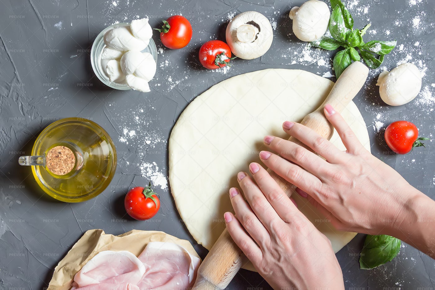 Hands Rolling Out Pizza Dough: Stock Photos