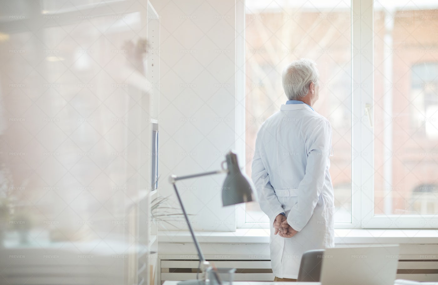 Doctor At The Window: Stock Photos