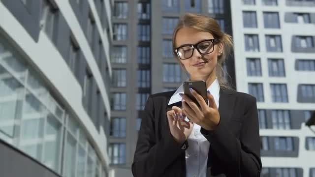 Happy Businesswoman Texting On Phone: Stock Video