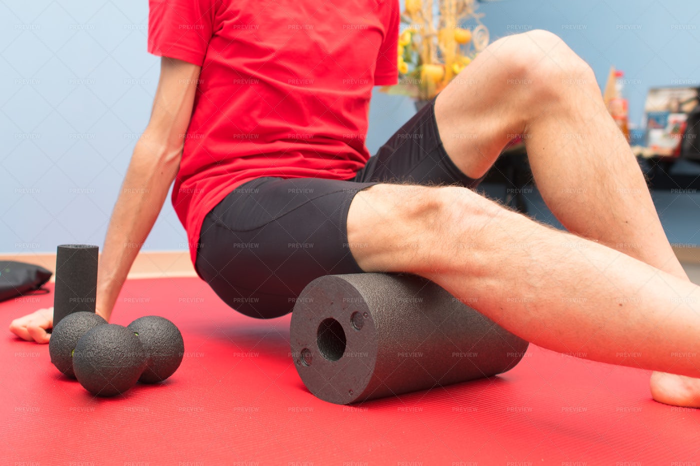 Foam Roller Thigh Treatment: Stock Photos
