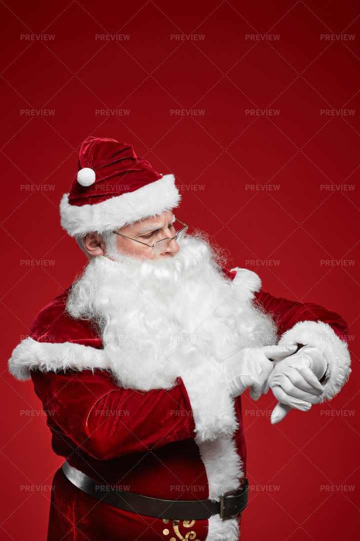 Santa Checking The Time: Stock Photos
