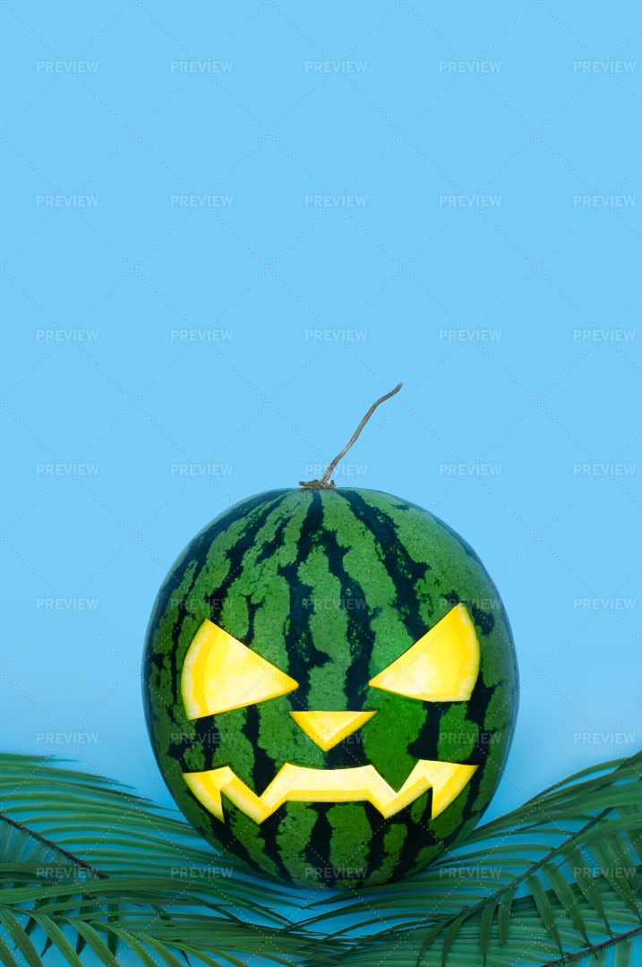 Glowing Carved Halloween Watermelon: Stock Photos