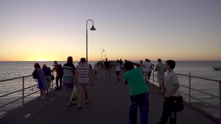 Tourists On Pier At Sunset: Stock Video