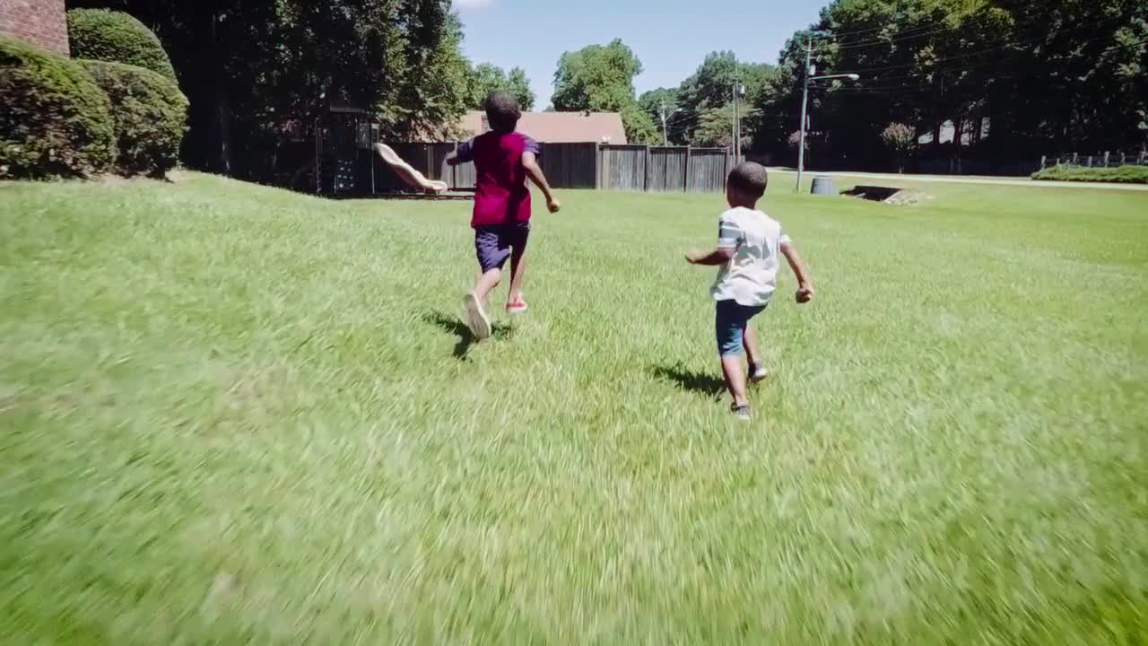 Kids Run Through Grass Stock Video Motion Array