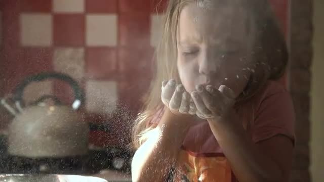 Young Girl Blowing White Flour : Stock Video