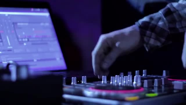 DJ Mixes Tracks In Nightclub: Stock Video
