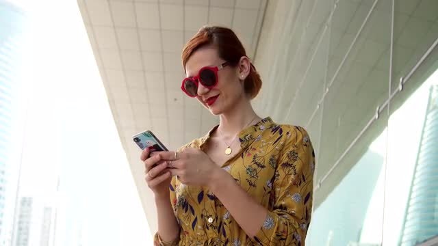 Woman Reading Text On Smartphone : Stock Video