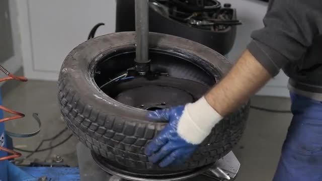 Putting Tire On The Rim: Stock Video