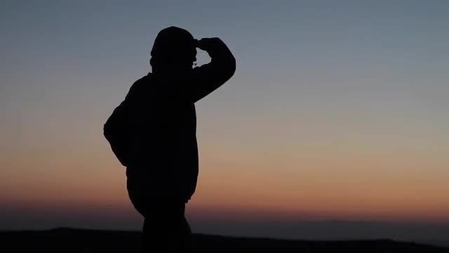 Silhouetted Man Looking Into Distance : Stock Video