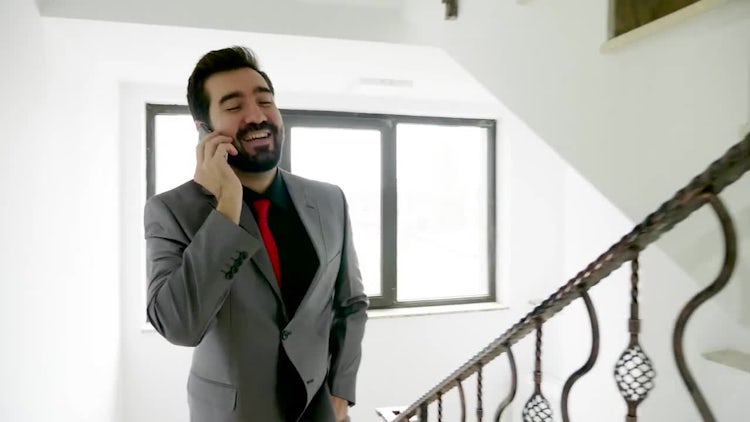 Businessman Takes Call On Stairs: Stock Video