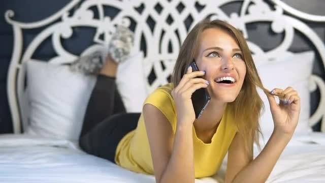 Girl Talking On Phone Happily: Stock Video
