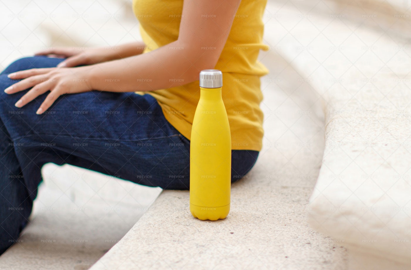 Young Woman Sits Near Bottle: Stock Photos