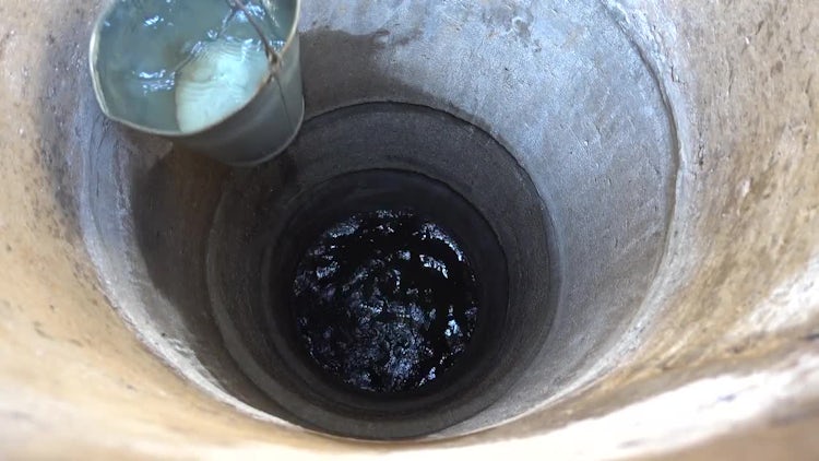 Drawing Water With A Bucket: Stock Video