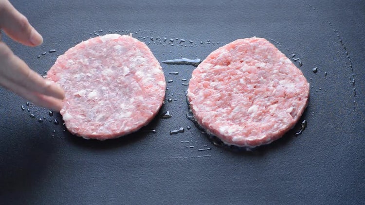 Frying Two Burger Patties: Stock Video