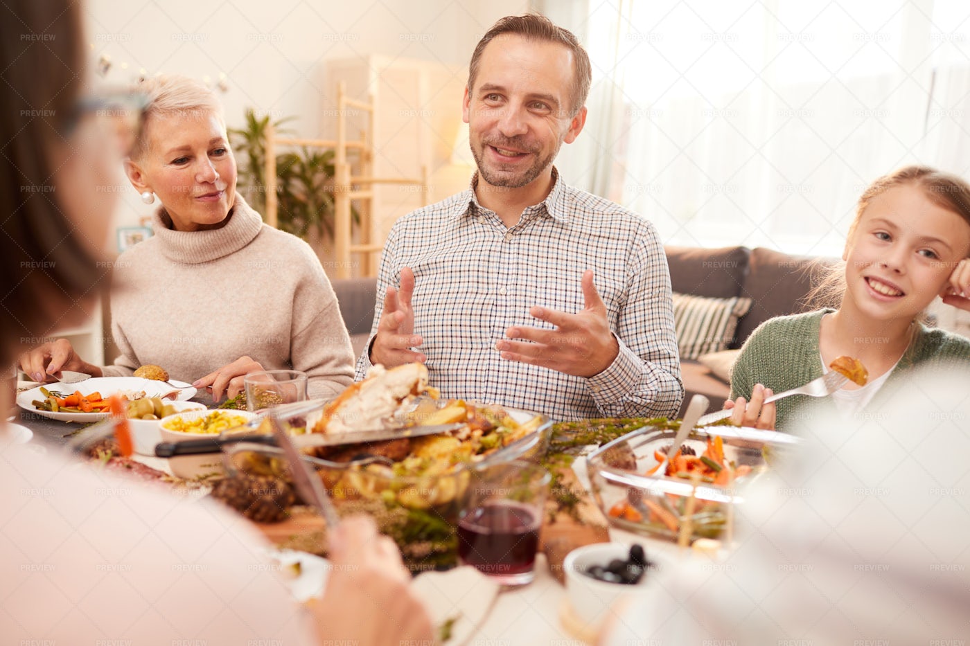 Joyful Family Having Dinner: Stock Photos