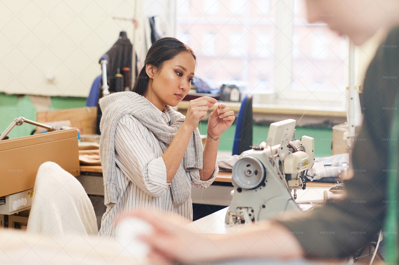 Woman Sewing With Needle: Stock Photos
