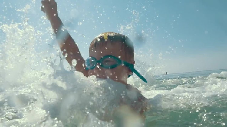 Happy Child Enjoying Splashing: Stock Video