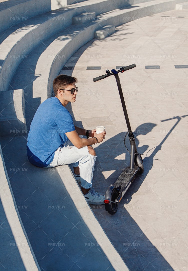 Man Near Electric Scooter: Stock Photos