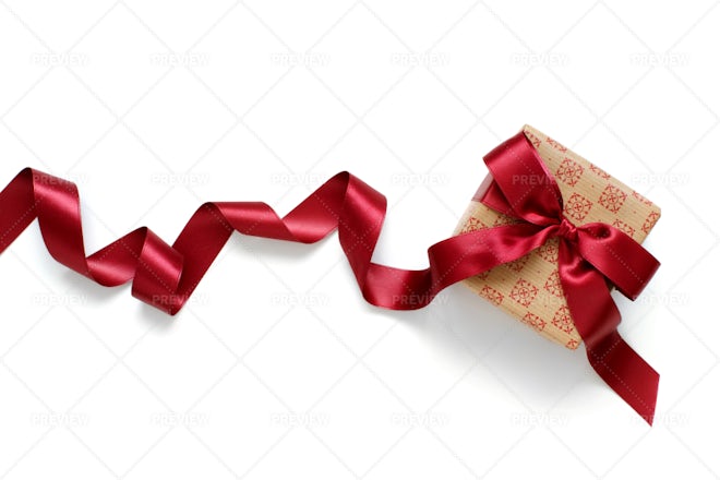 Knotted Bow Made Of Red Silk Ribbon - Stock Photos