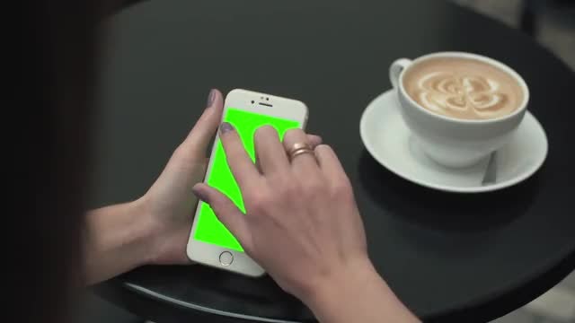 Using Phone While In Cafe: Stock Video