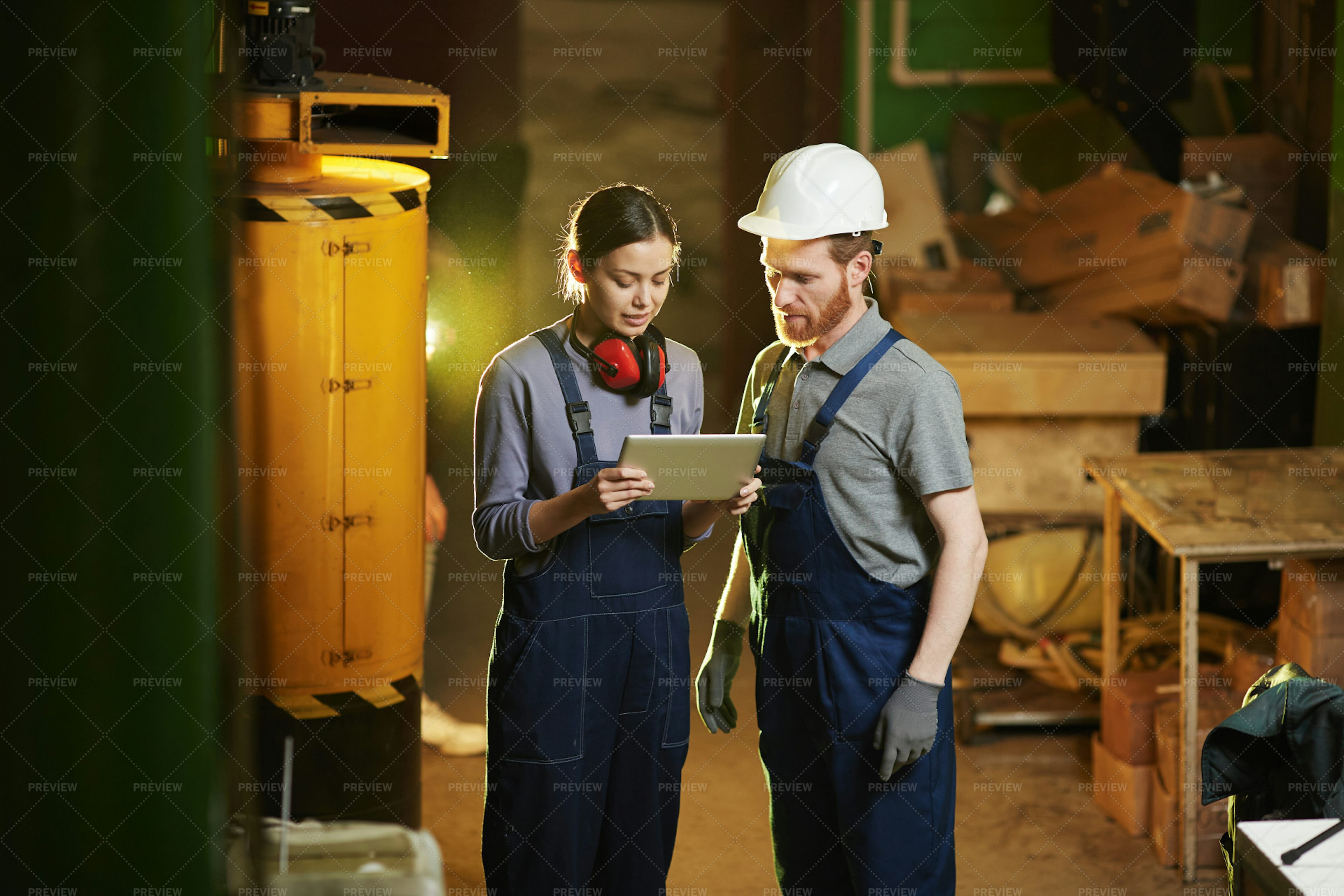 workers-in-the-factory-stock-photos-motion-array