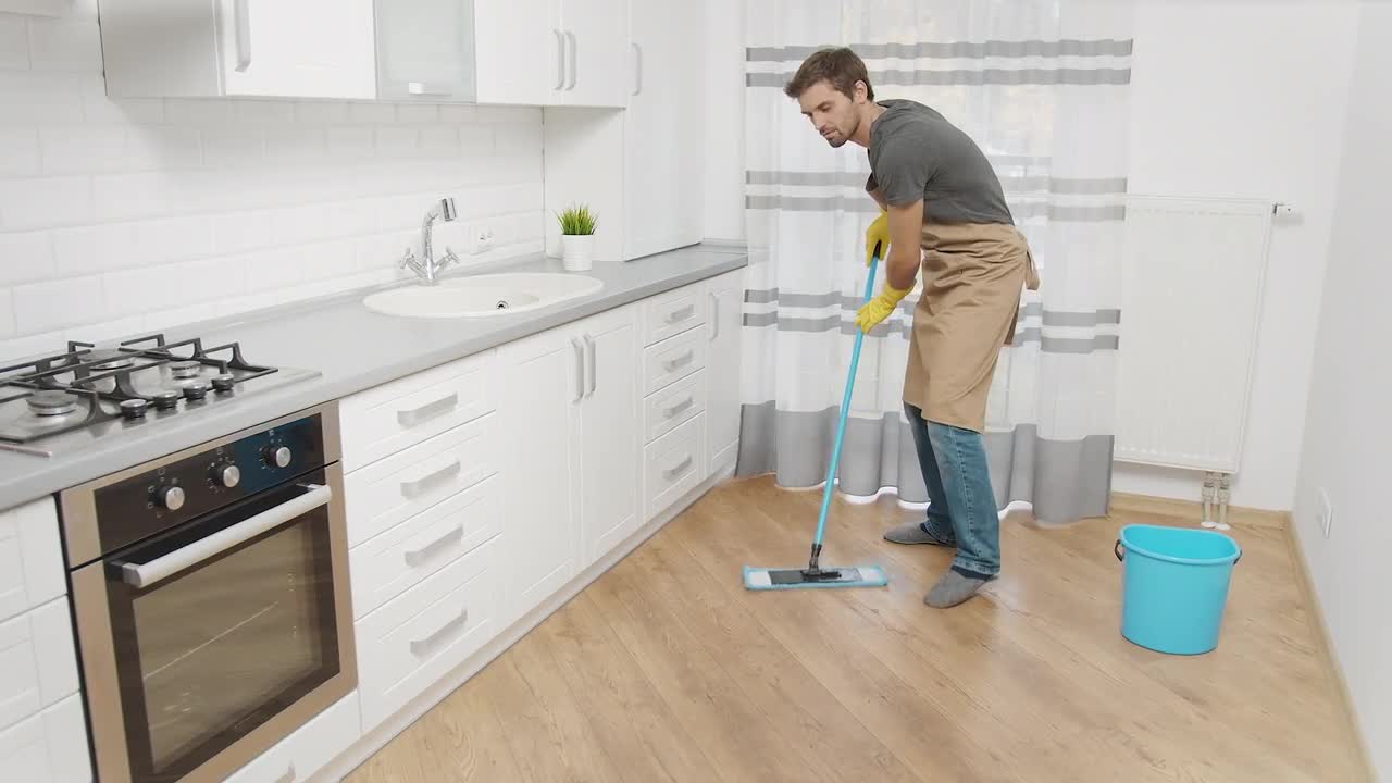 Man Mopping Kitchen Floor Stock Video Motion Array