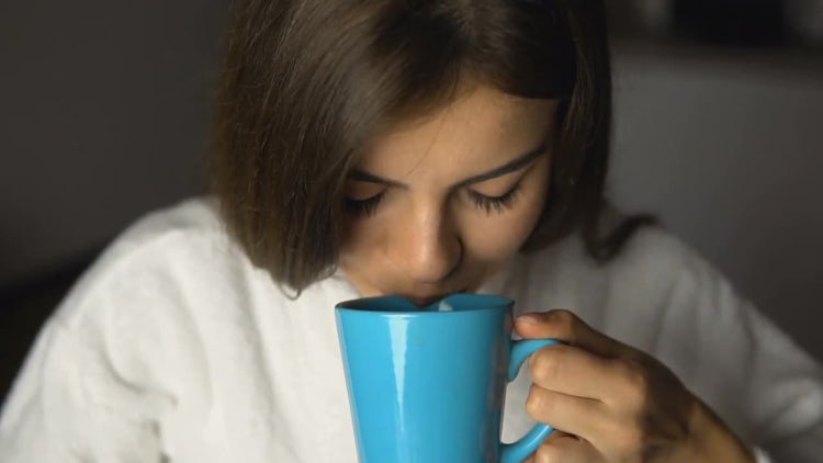 Beautiful Girl Enjoys Coffee Time: Stock Video
