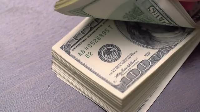 Bundle of American Dollars On A Table: Stock Video