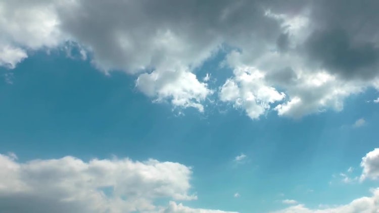 Cumulus Clouds Under Clear Sky: Stock Video