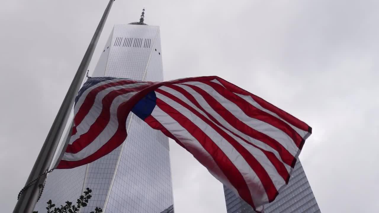 American Flag And 1 World Trade Center Stock Video Motion Array