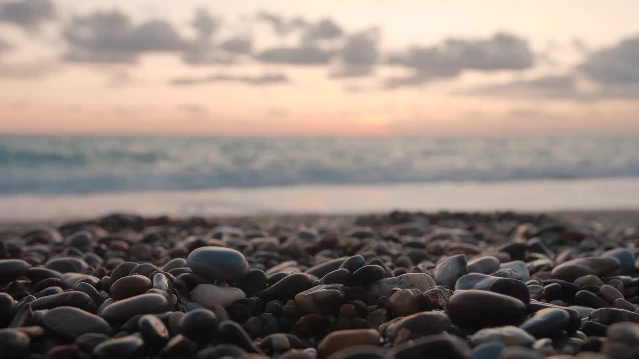 Pebbles On Beach At Sunset - Stock Video | Motion Array