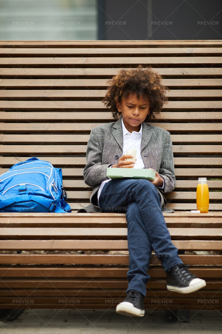 Boy Having Lunch Alone: Stock Photos