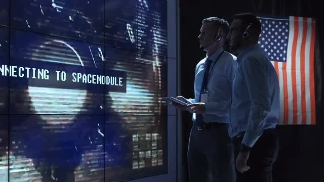 People Controlling A Landing Spacecraft : Stock Video