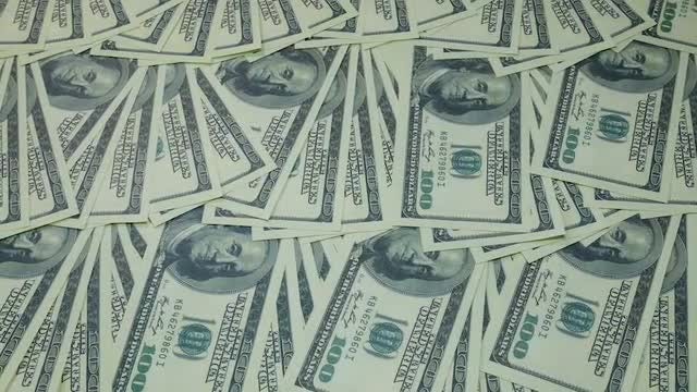 Panning Shot Of Dollar Notes: Stock Video