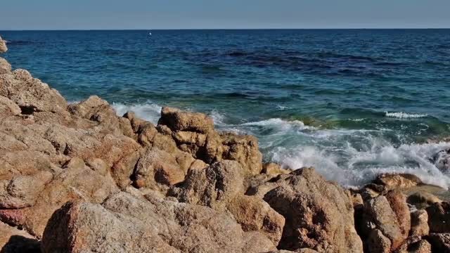 Ocean Waves Crashing Into Rocks: Stock Video