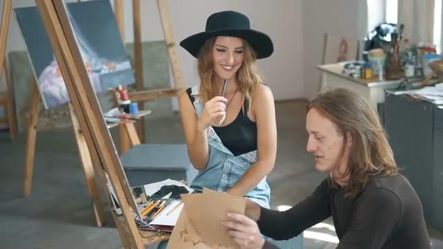Fine Artists Discussing A Project: Stock Video