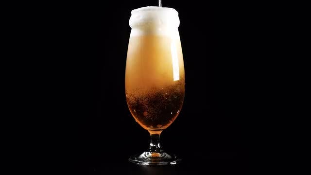 Cold Beer Poured Into Glass: Stock Video