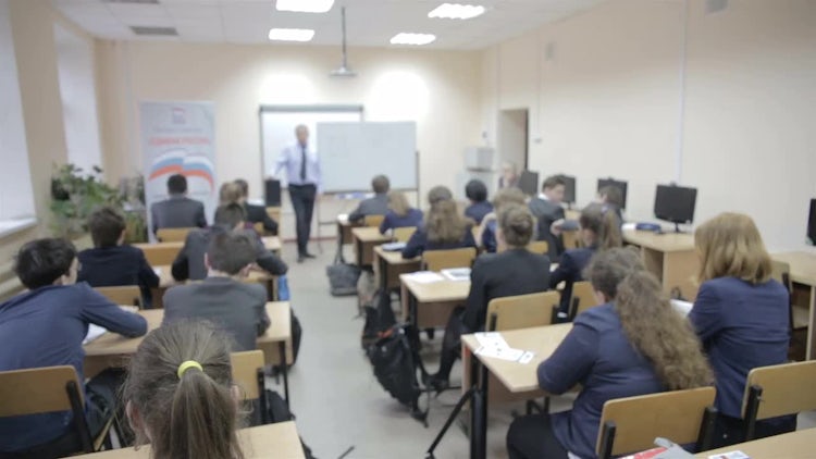 Teacher Teaches In The Classroom: Stock Video