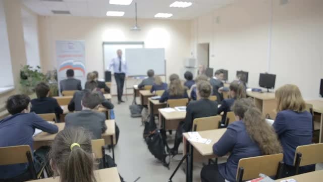 Teacher Teaches In The Classroom: Stock Video