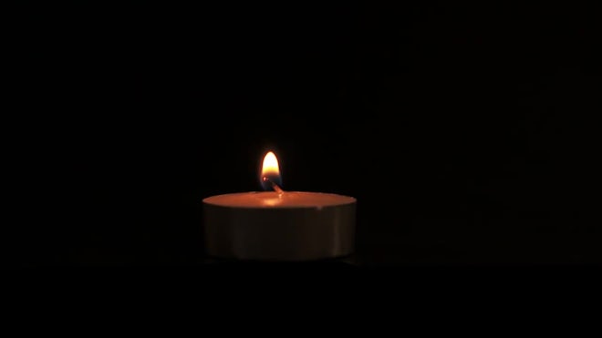 Candle Burns On A Black Background - Stock Video | Motion Array