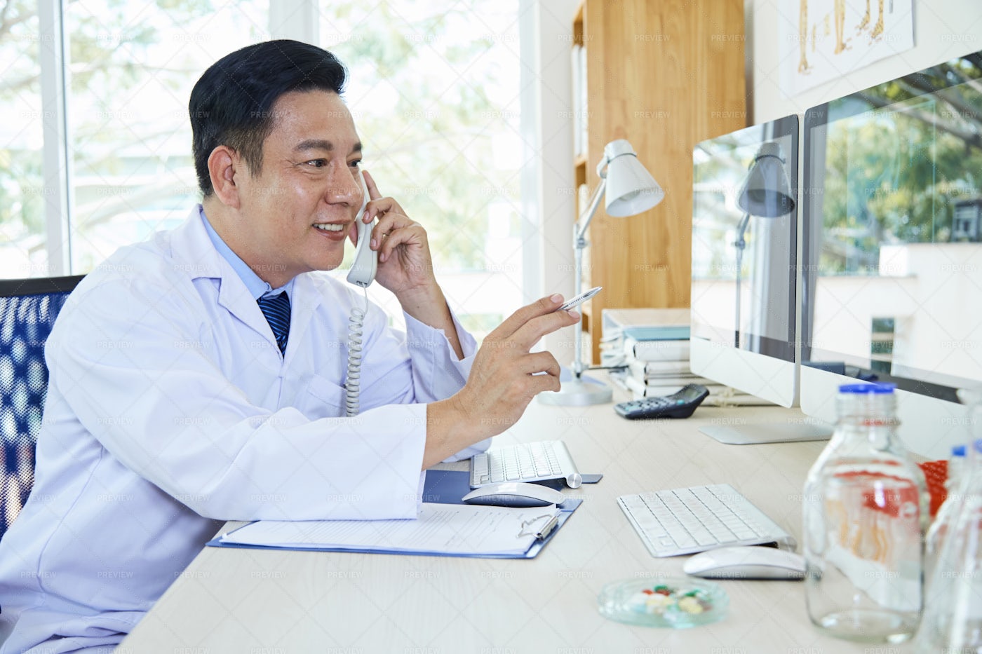 A Doctor On The Phone: Stock Photos