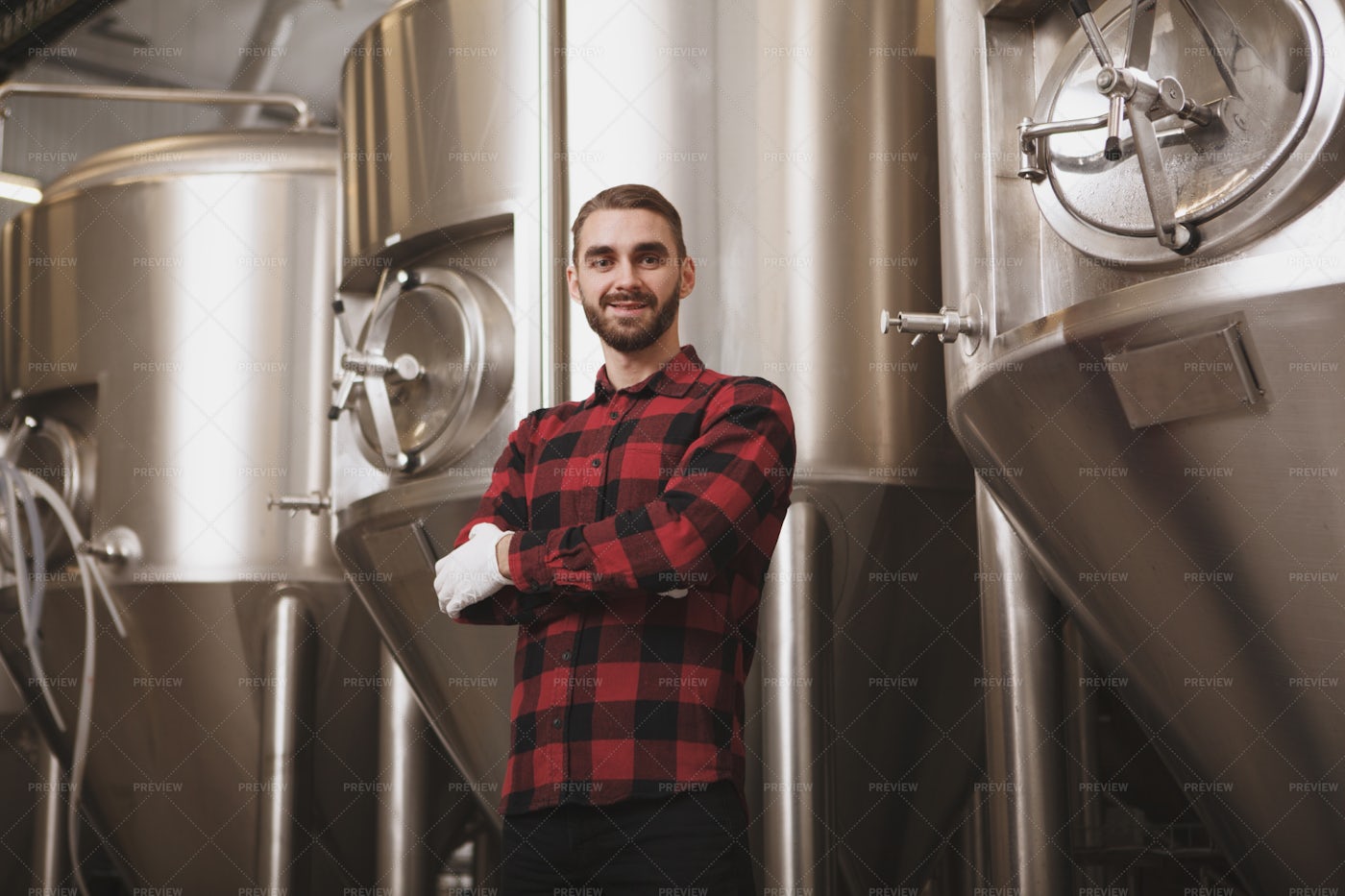 Cheerful Brewer At Factory: Stock Photos