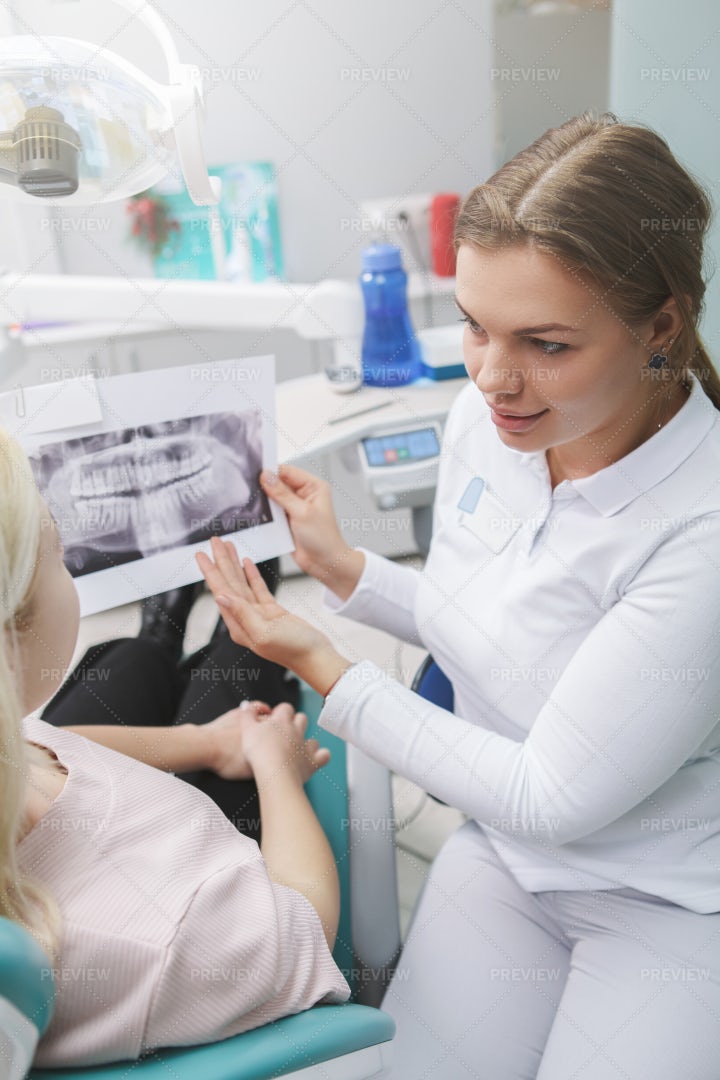 Dentist Showing X-ray: Stock Photos