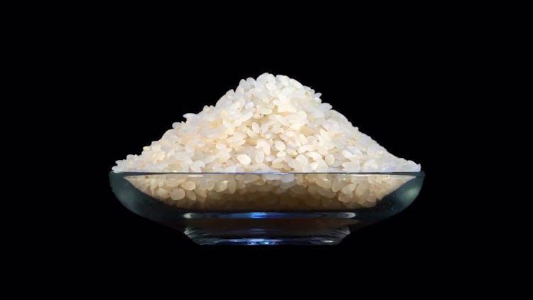 Rice In Rotating Glass Bowl: Stock Video
